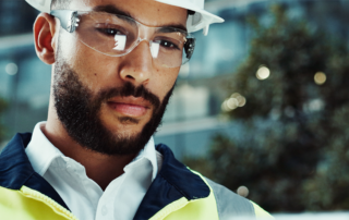 Man in construction looking at tablet