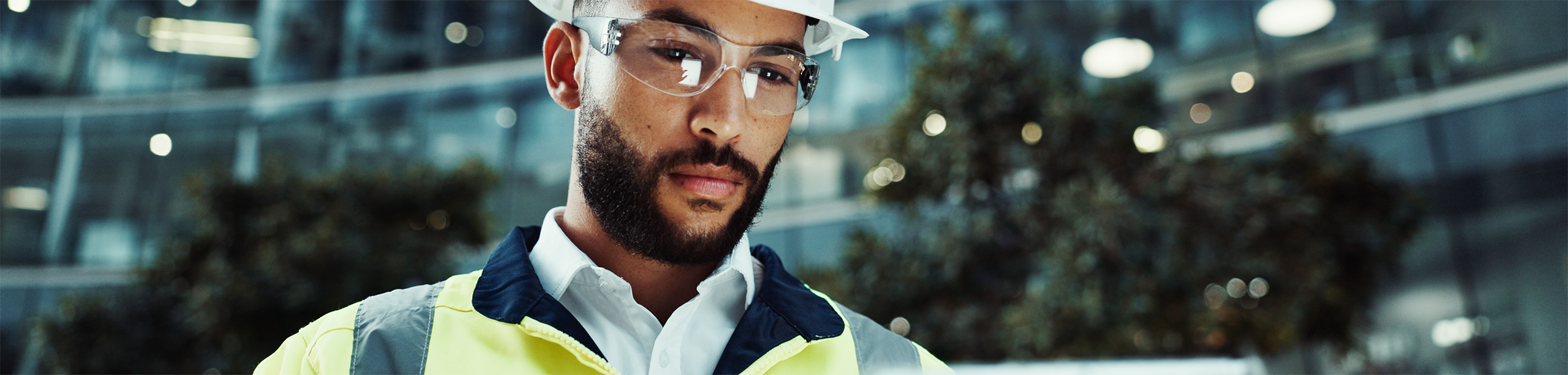 Man in construction looking at tablet